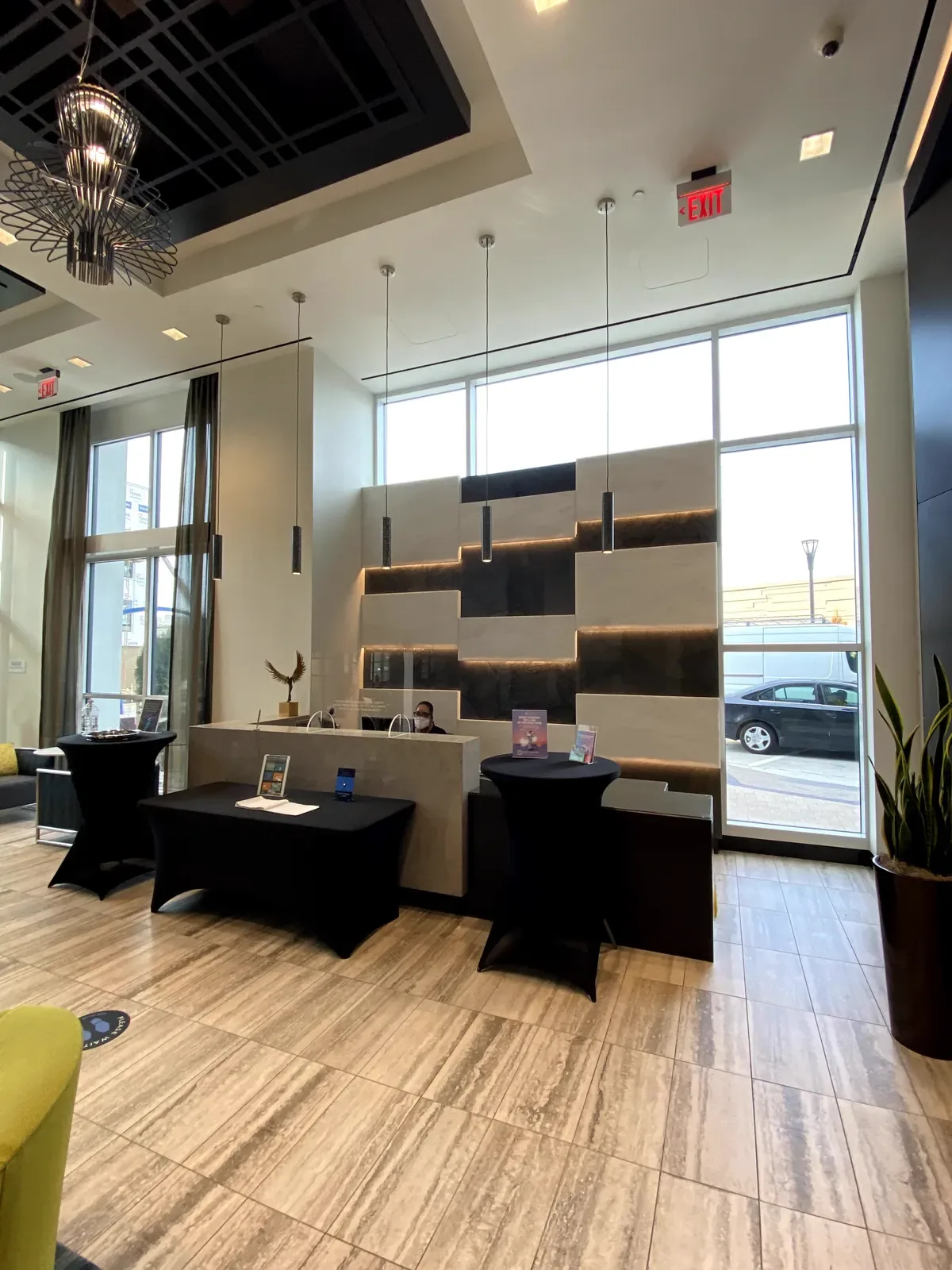 Backlit dimensional stone reception wall at Telek Place